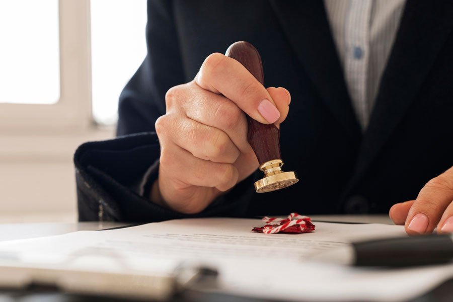 Person using wax seal certficate